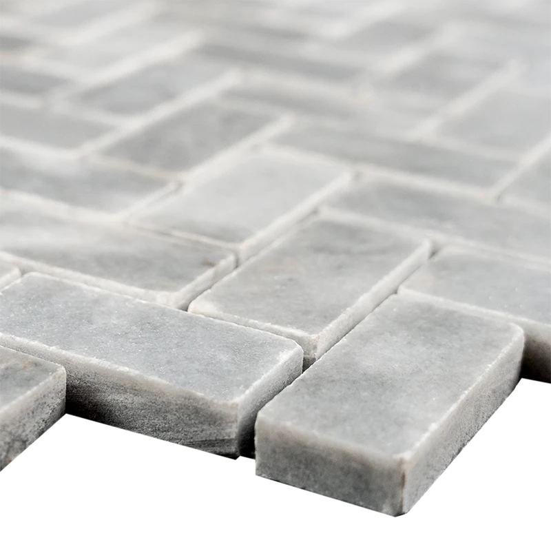 Close-up of Bardiglio Herringbone Polished Marble Mosaic Tile edges showing the gray color and smooth polished finish.
