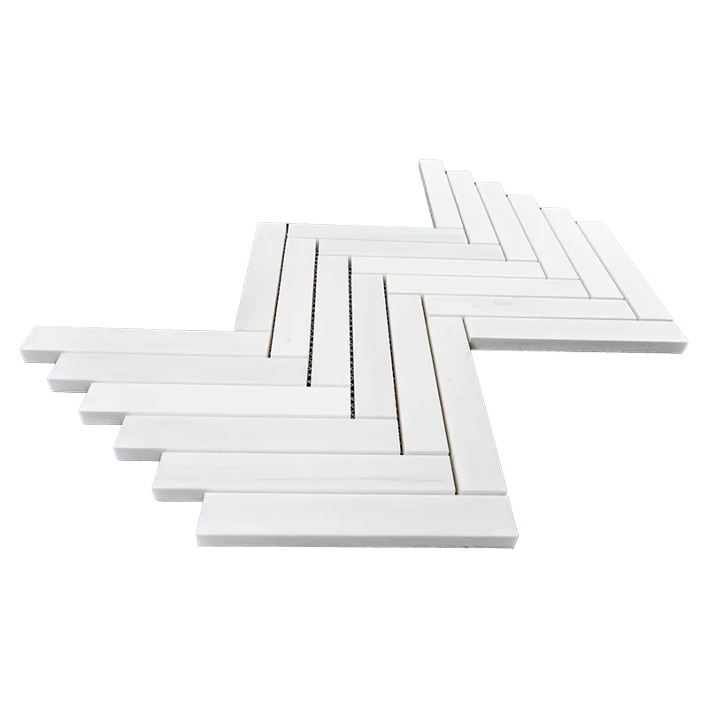 Dolomite herringbone mosaic tile laid in a V-pattern with a smooth, honed finish, showcasing a seamless, elegant design suitable for luxurious interior applications.