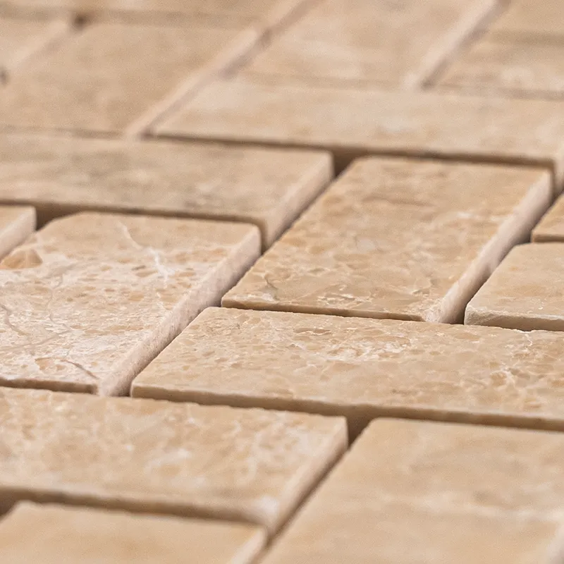 Close-up of Royal Beige Herringbone Polished Marble Mosaic sheet showing warm beige tones and natural veining.