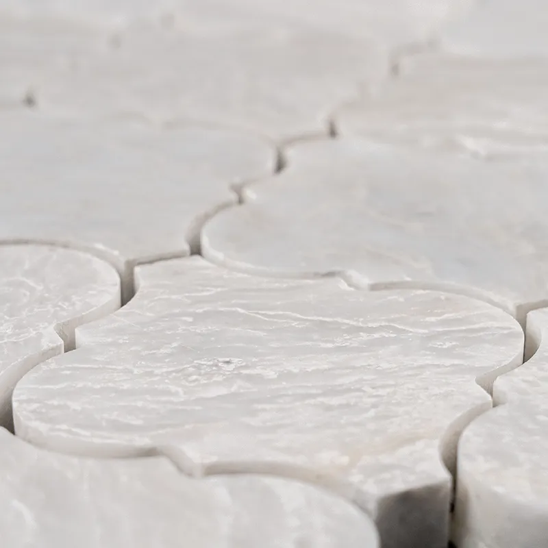 Close-up of Iceberg Arabesque Polished marble mosaic tile highlighting texture and white-gray veining