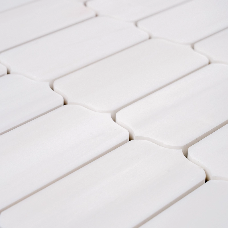 A horizontal dolomite mosaic tile layout featuring soft white tones and slight gray veining, arranged in a neat row pattern.