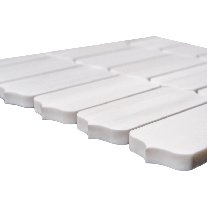 A uniform white dolomite mosaic tile layout with subtle texture and slight natural variation, arranged neatly in rows.