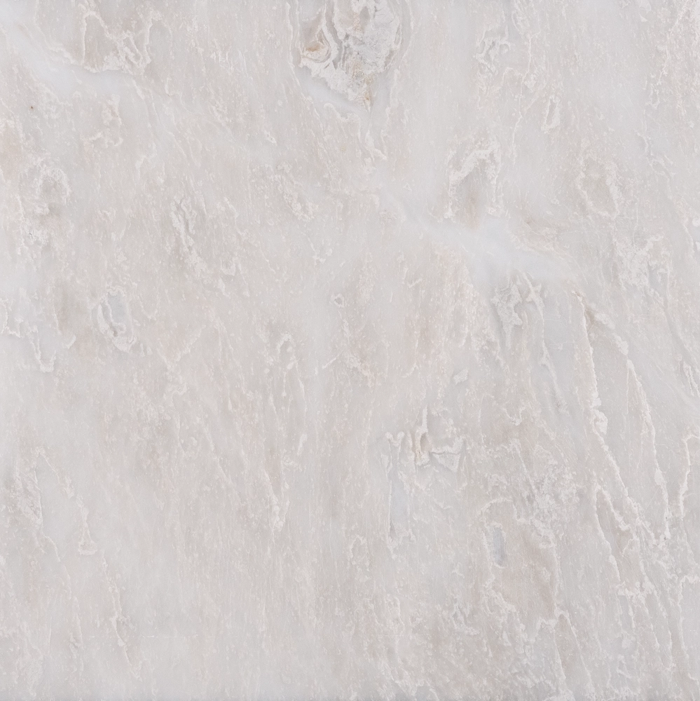 Detailed close-up of the Iceberg polished marble tile showing white surface with icy veining and subtle texture.