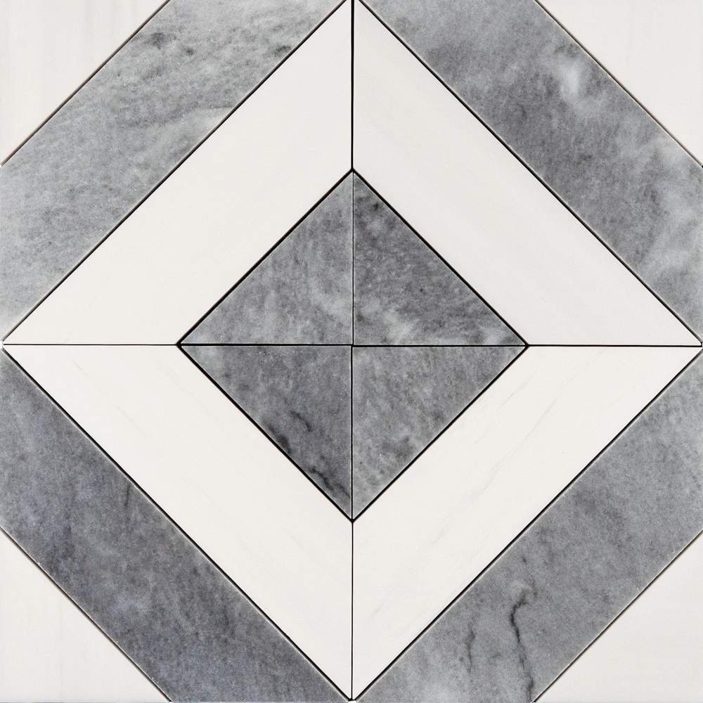 Overhead view of a marble mosaic tile sheet featuring a symmetrical diamond pattern formed by alternating white and gray marble pieces, each precisely cut and polished, with subtle gray veining adding depth and dimension to the overall geometric composition.