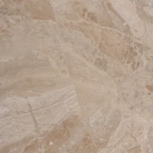 Top view of a honed Royal Beige marble tile showcasing its warm beige tones with dynamic natural veining.