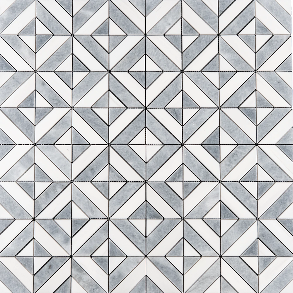 A geometric mosaic tile design in white and gray tones. The tile features a diamond and square pattern formed by small, intricately cut triangular and rectangular pieces.