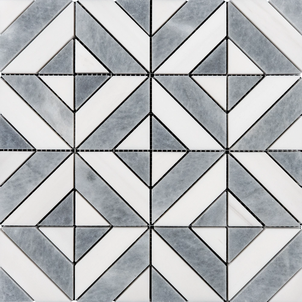 Close-up of the geometric mosaic tile with white and gray pieces forming a symmetrical diamond and square pattern, highlighting the crisp edges and grout lines.