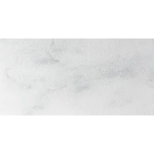 Avalon White 12x24 leather finish marble paver featuring soft gray veining and a textured, matte surface, ideal for contemporary outdoor installations