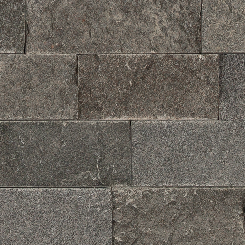 Close-up of Basalt 6x24 splitface ledgestone panel – textured black veining stone surface with natural split finish