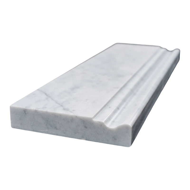 Angled side view of Carrara baseboard tile showing its depth and polished bullnose edge.