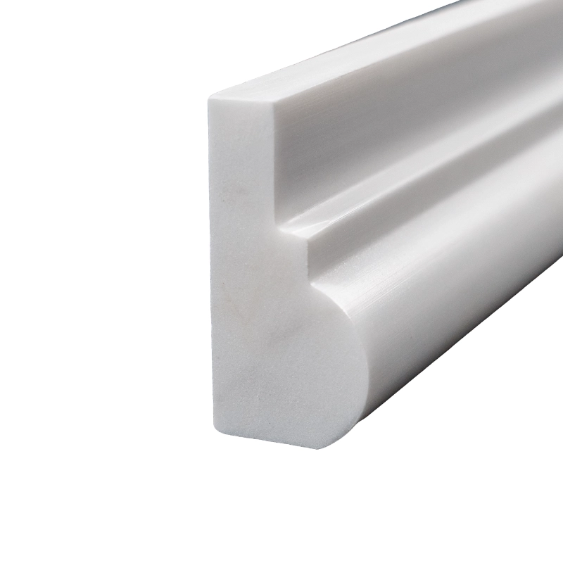 Close-up of the side profile of polished Dolomite white marble chair rail molding