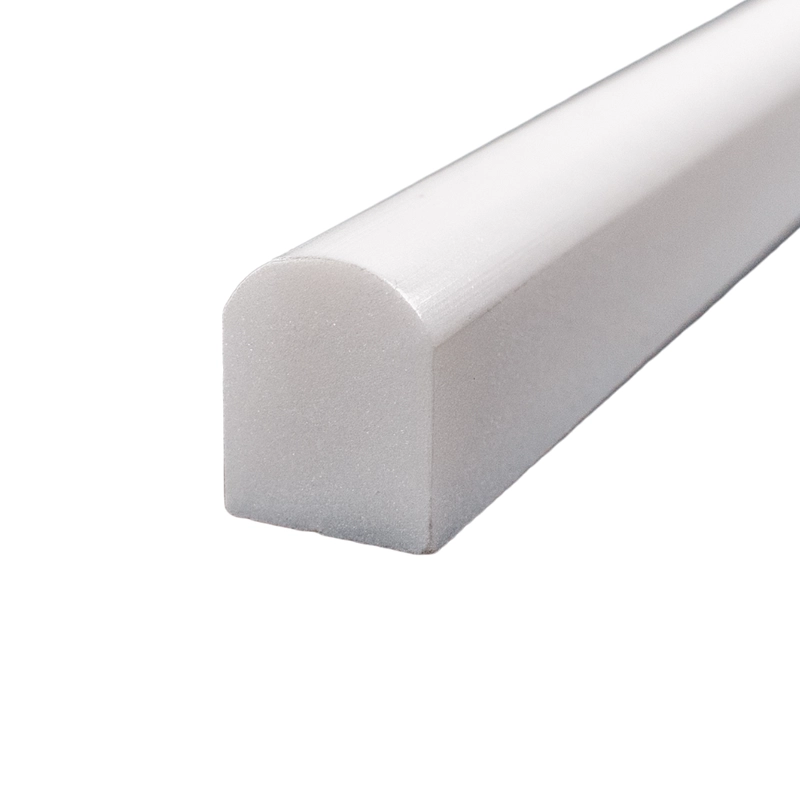 Front-side view of polished white Dolomite pencil liner trim with a glossy curved surface finish