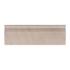 Straight-on image of honed limestone baseboard trim in beige tone with a defined molding edge.