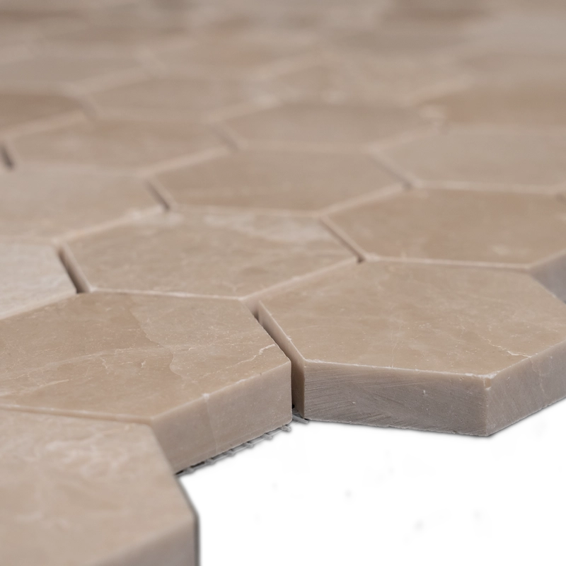 Close-up side view of Botticino 2-inch honeycomb honed marble mosaic tiles showing smooth finish and beveled edges.