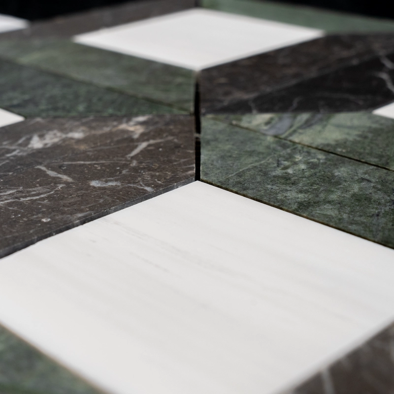 Close-up view of Dolomite, Ruby Green, and Pearl Black star square honed marble mosaic tiles showing detailed veining and smooth finish.