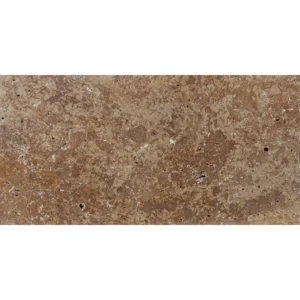 Romano tumbled travertine paver in 12x24 size displaying warm espresso-brown tones, scattered cream speckles, and natural pinholes.