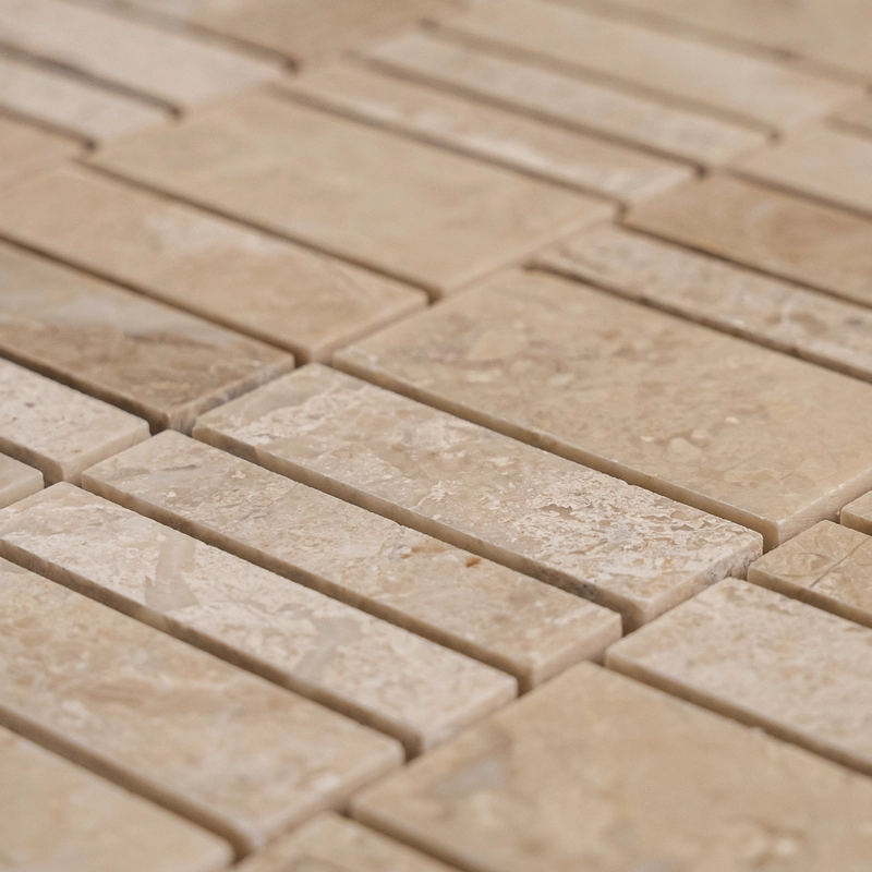 Close-up angle of polished Royal Beige marble strips showing subtle veining and tone variation.