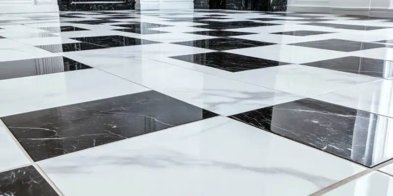 Classic checkerboard marble flooring in a bright hallway