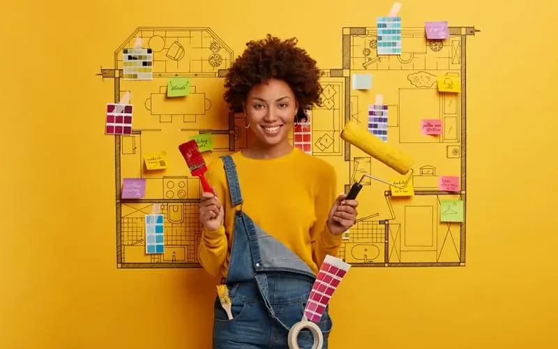 An interior designer holding architectural materials, showcasing modern natural stone products for stylish interior design by Stone Market USA